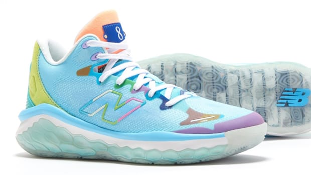 View of blue and white New Balance shoes.